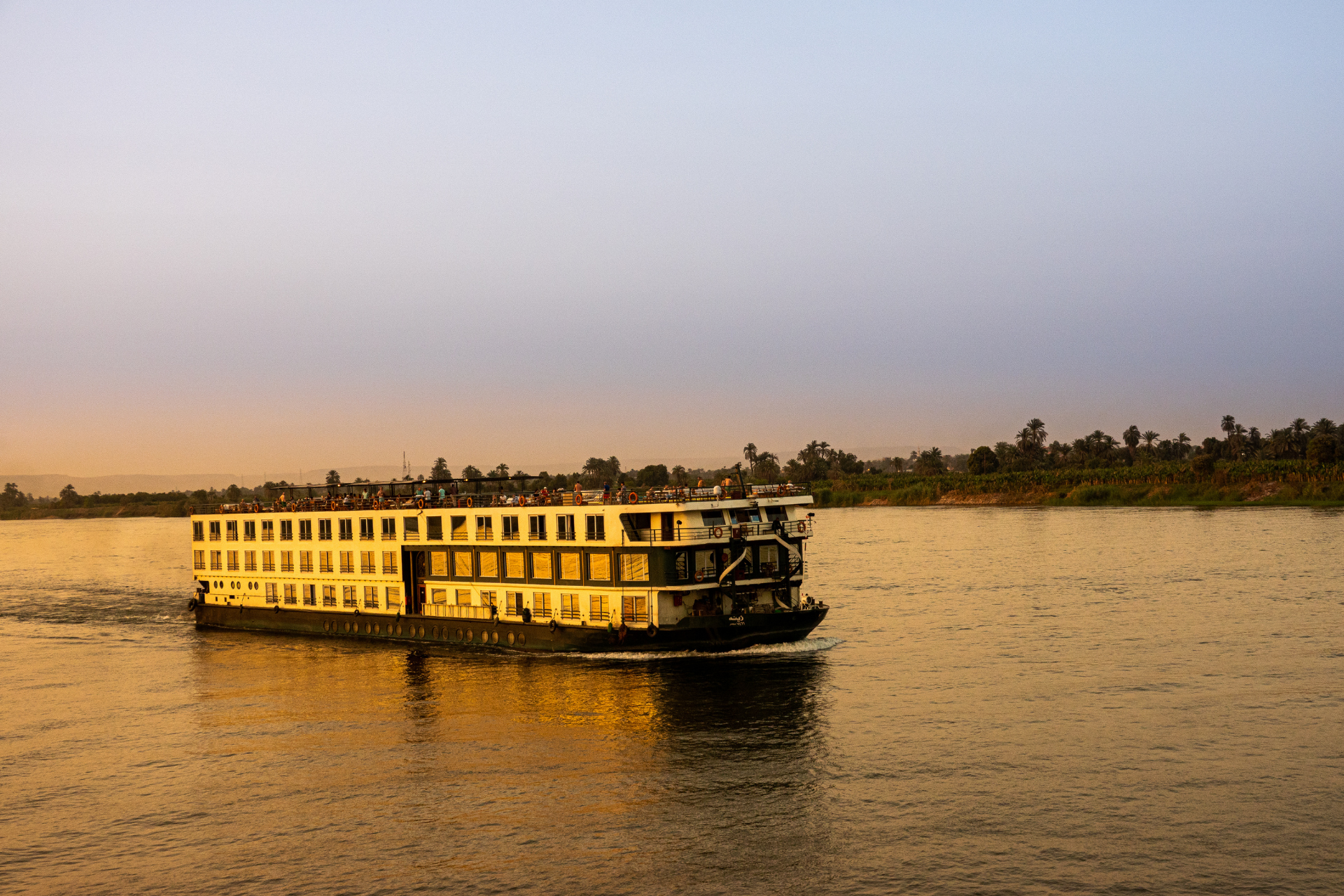 A Nile Cruise Ship Sails on the Nile at Sunset